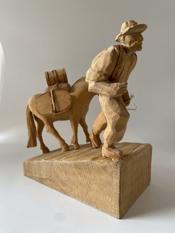 Mann med kløvhest treskjærerarbeid 